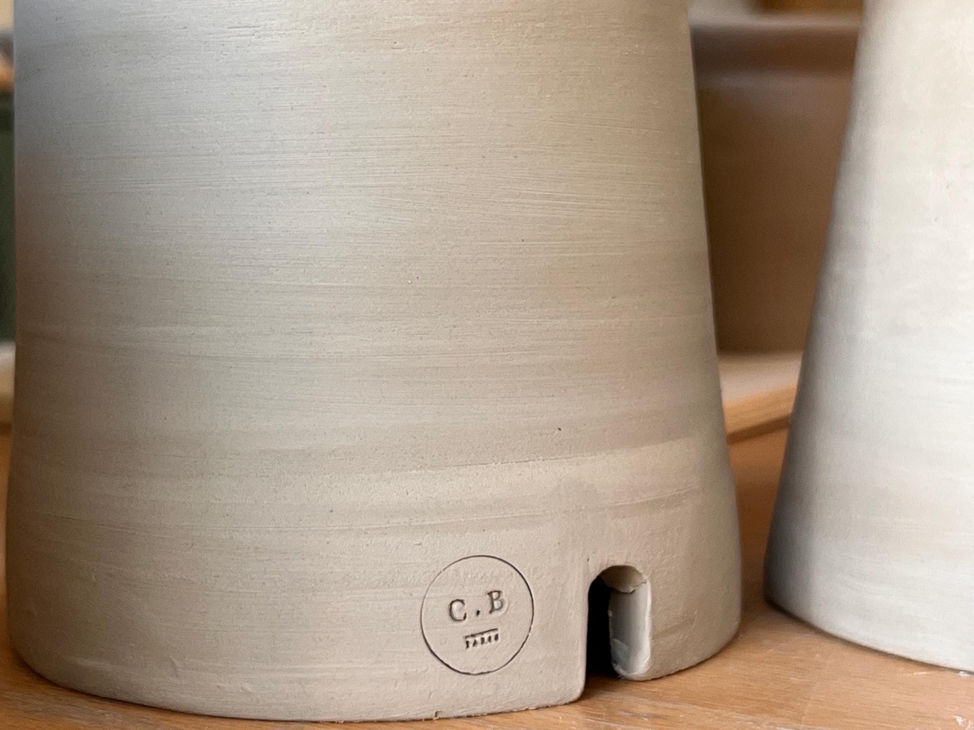 The C.B Paris stamp impressed into the clay underneath each creation