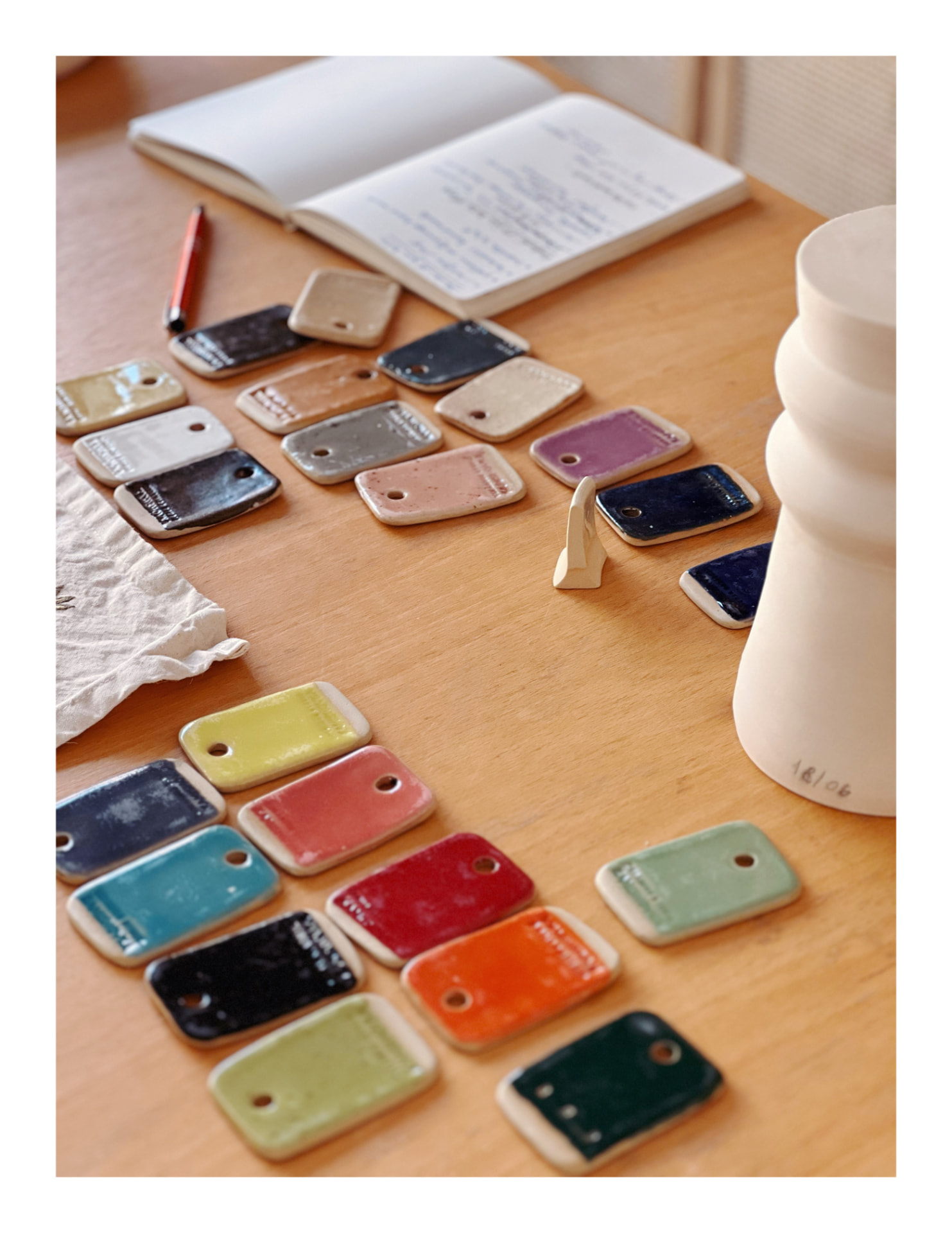 Ceramic glaze samples and notebook in the studio